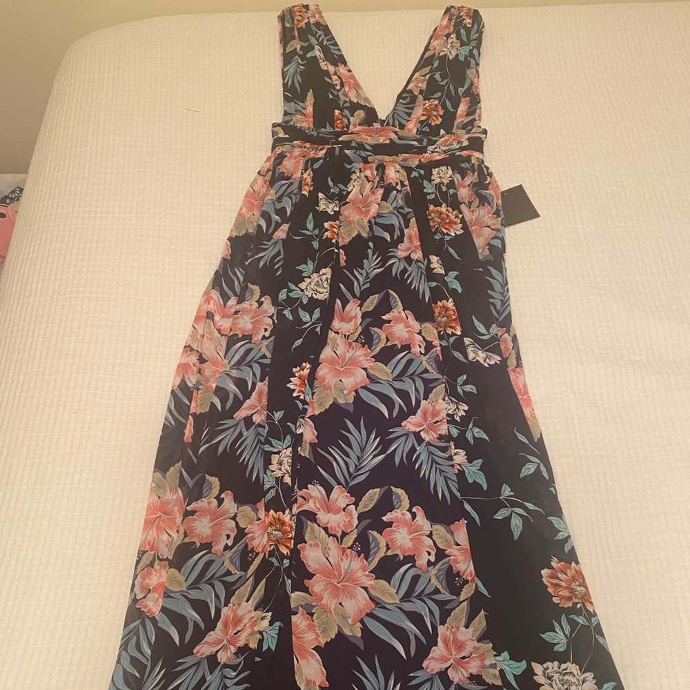 Beautiful new navy floral maxi dress. V-cut chest and back.